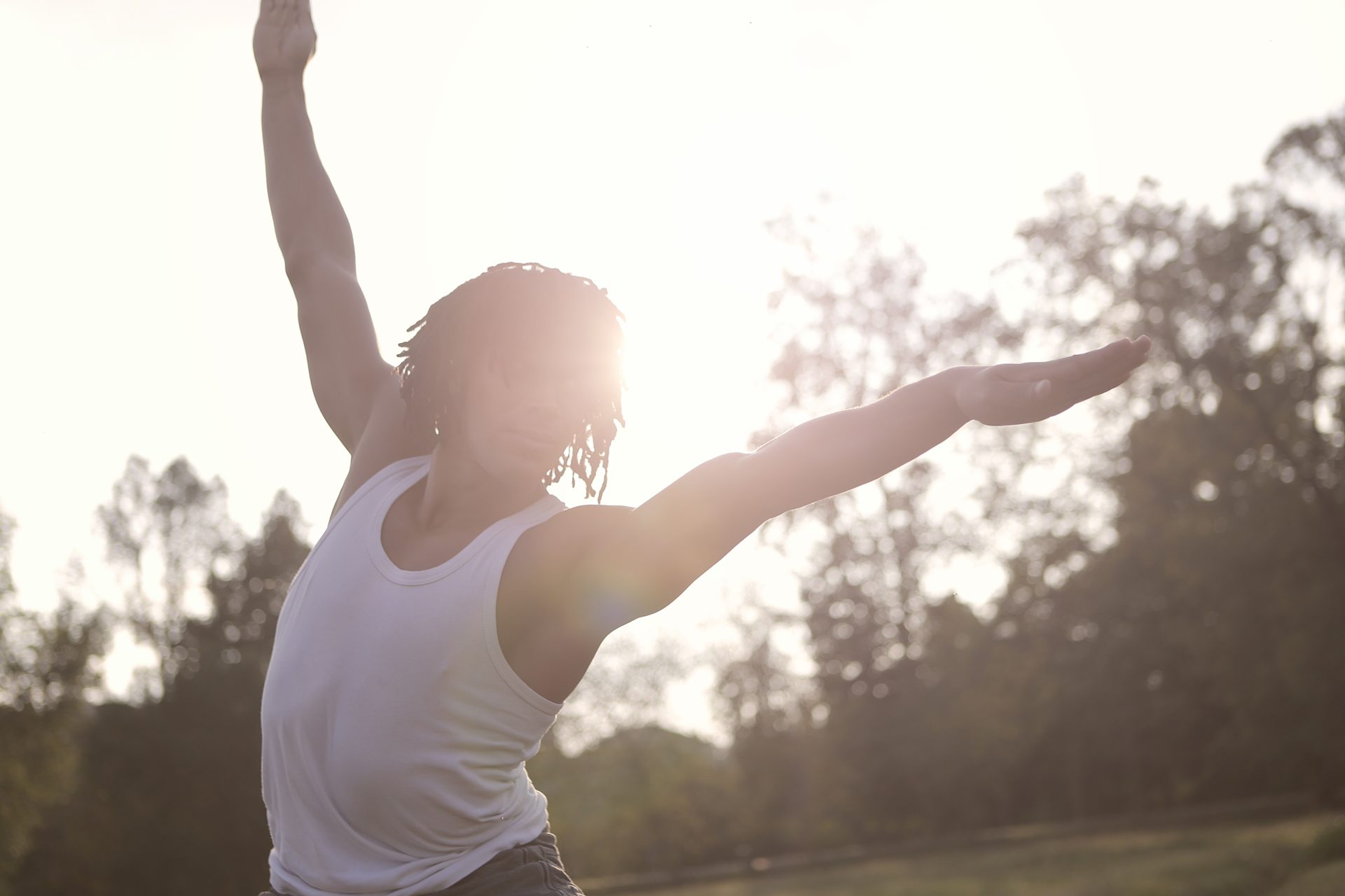 Young man doing exercises in nature