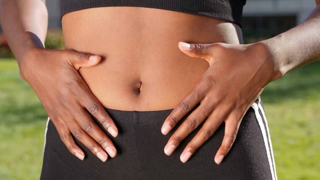 A Person Touching Her Belly