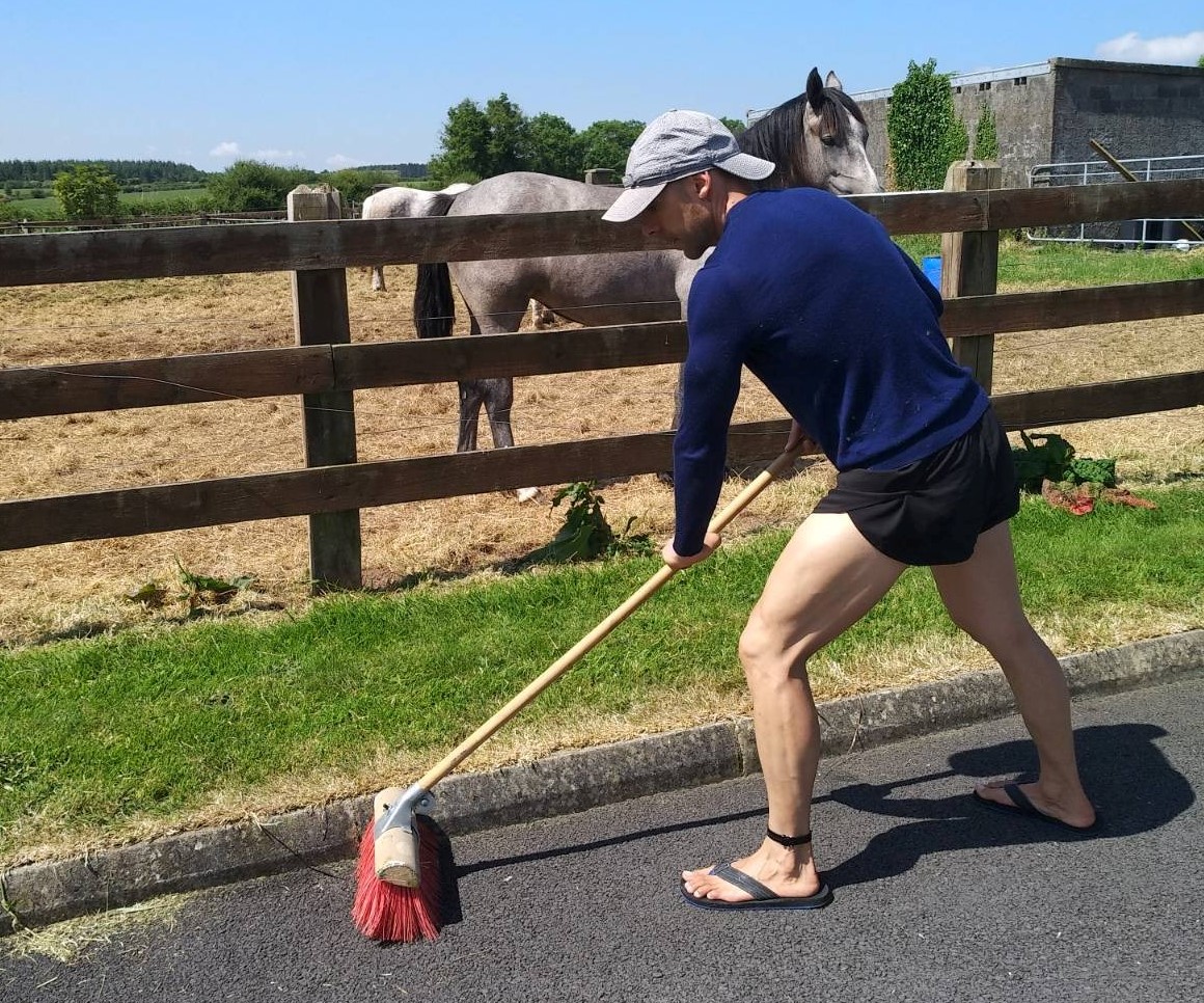 Manuel sweeping the tarmac