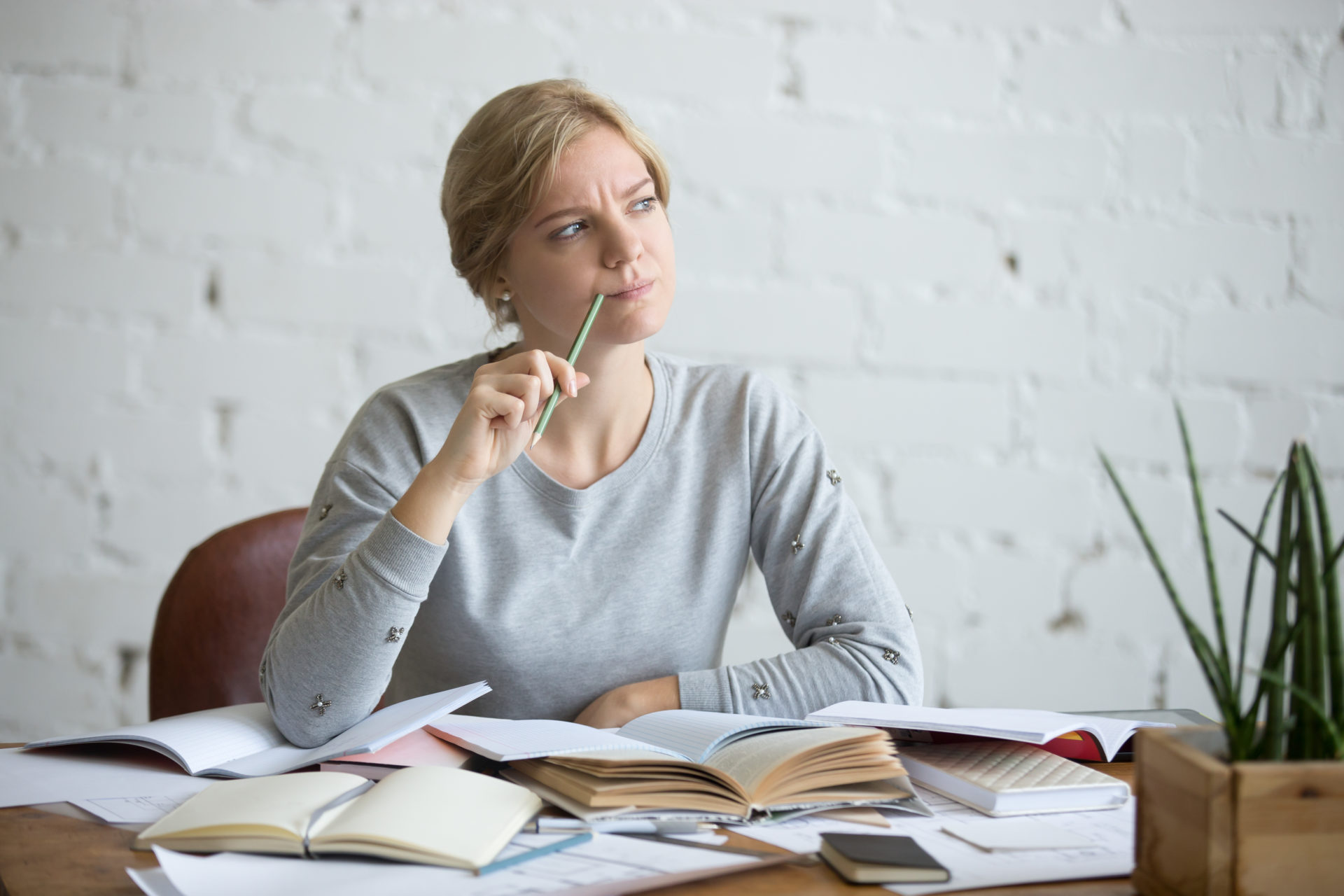 woman at the desk, frowned