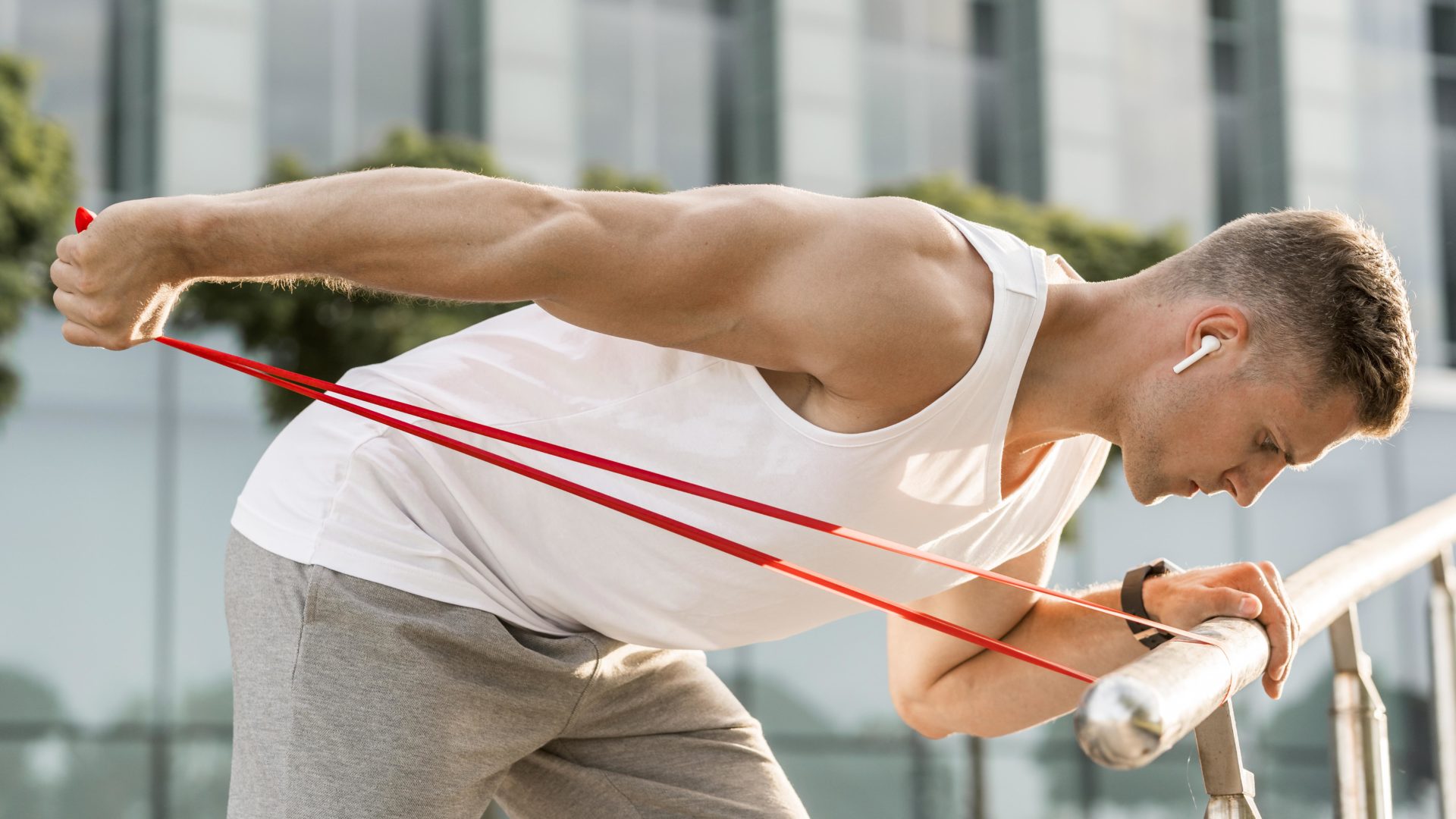 Sideways athletic man training outdoors