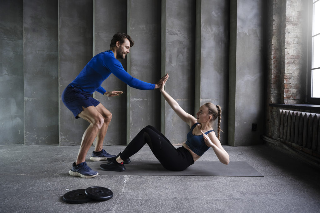 sporty people working out inside