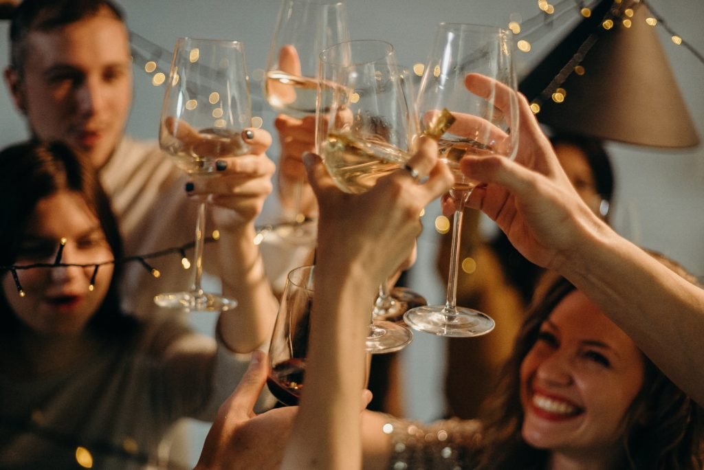 Photography of Several People Cheering Wine Glasses