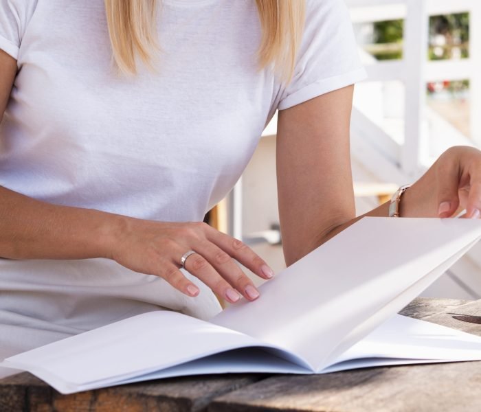 a woman reading a guide