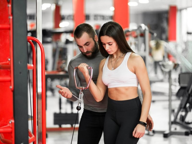 Couple at gym exercising