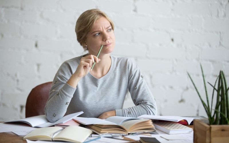 woman at the desk, frowned